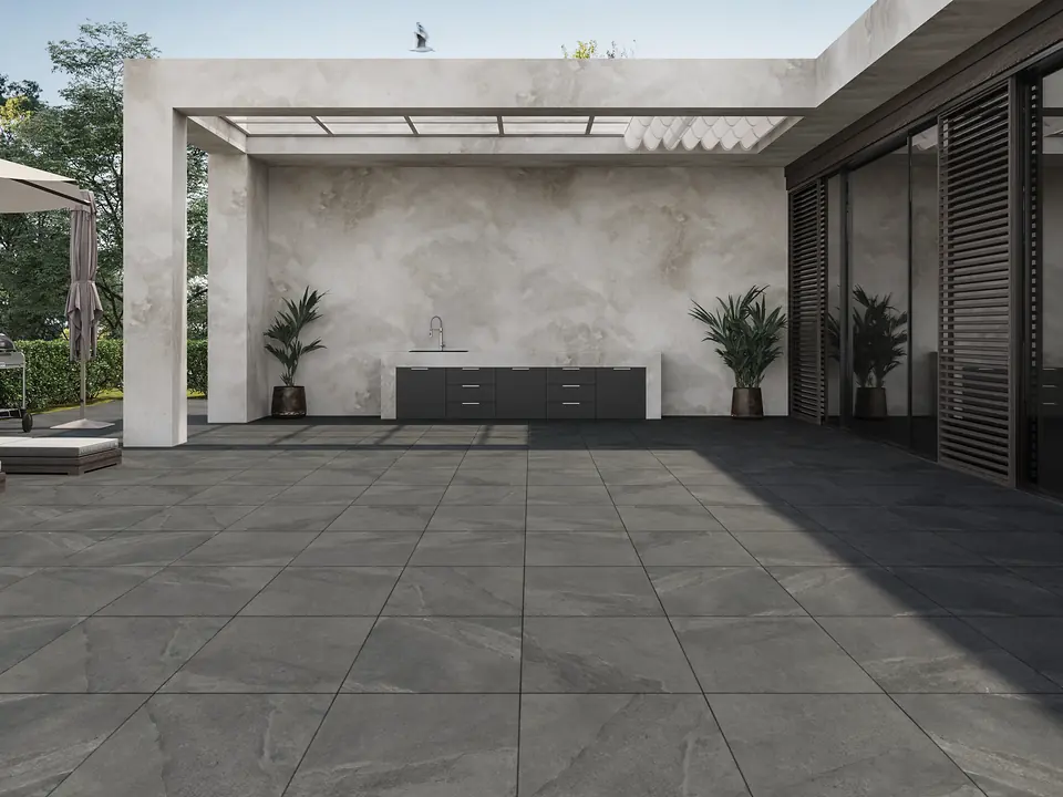 Outdoor patio with dark grey 20 mm porcelain stock tiles