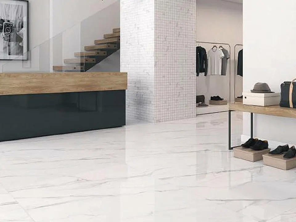 Shop with a light marble-effect porcelain floor laid with stock tiles